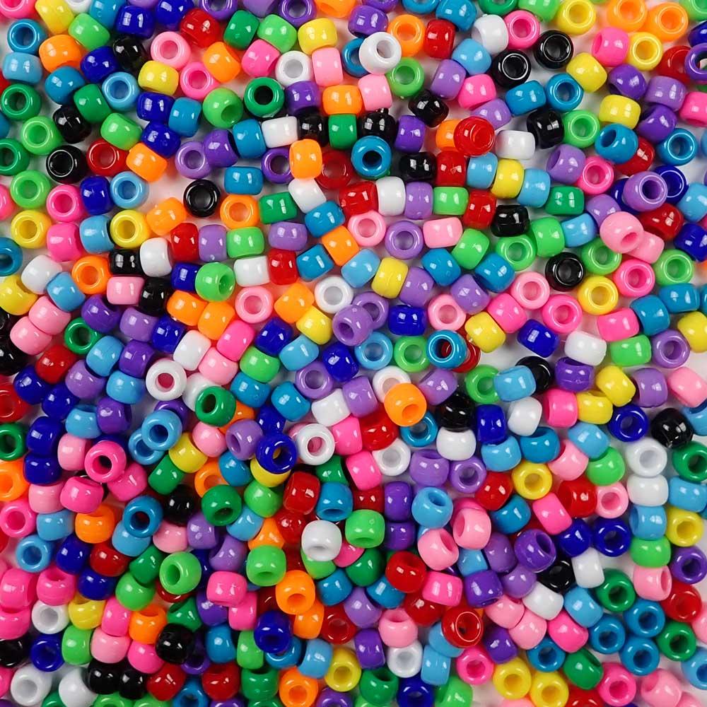 An assortment of opaque colors of 6 x 9mm Plastic Pony Beads