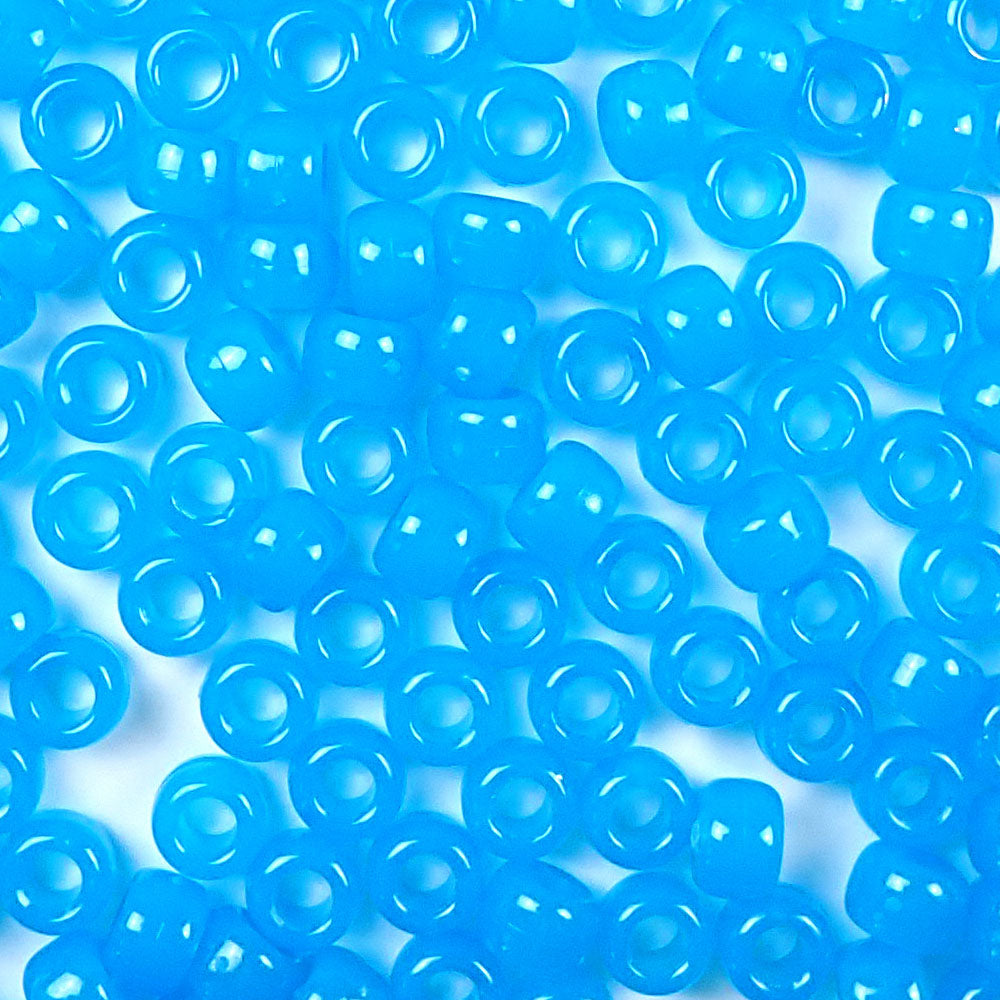 Blue Glow Plastic Pony Beads. Size 6 x 9 mm. Craft Beads. Made in the USA.