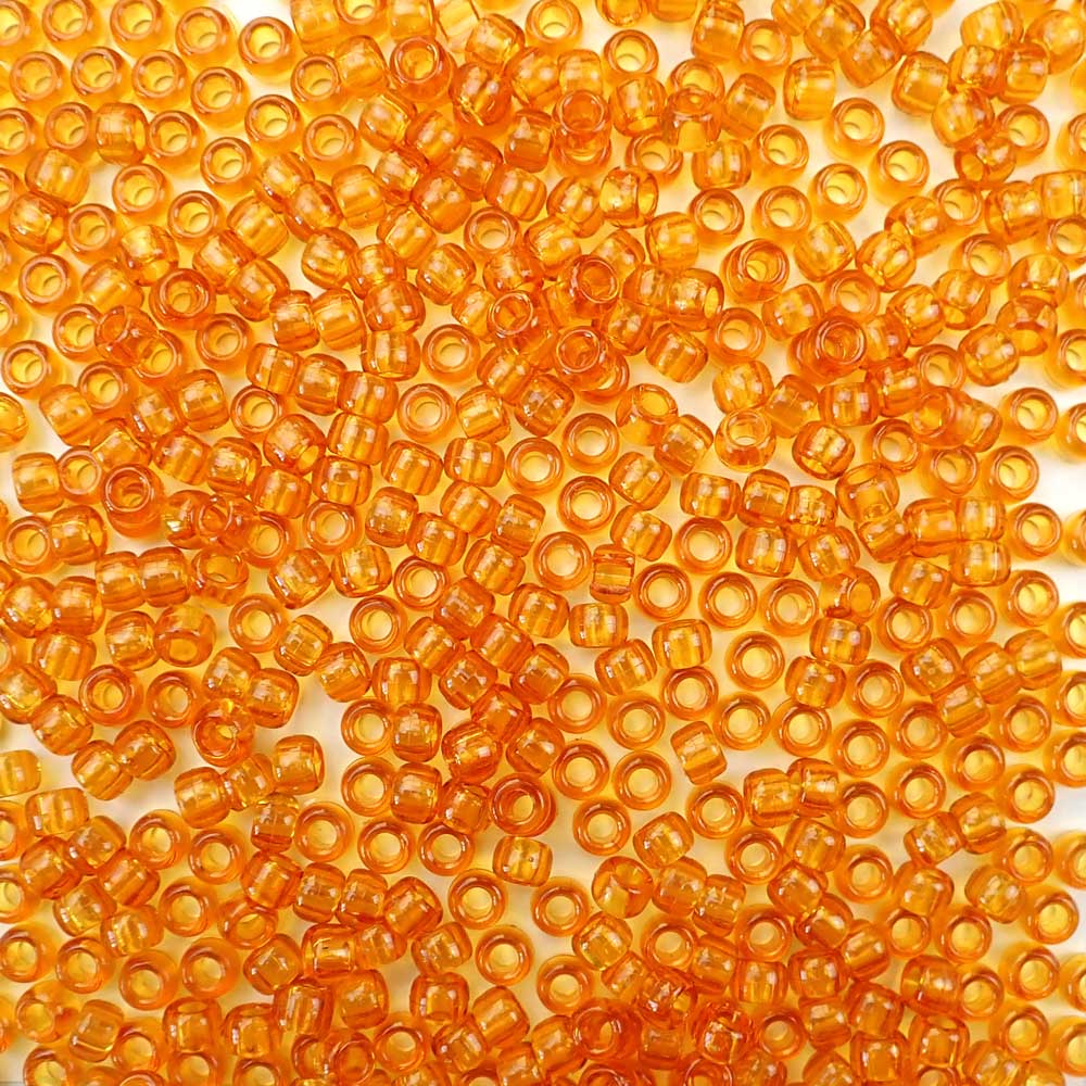 6 x 9mm plastic pony beads in transparent topaz