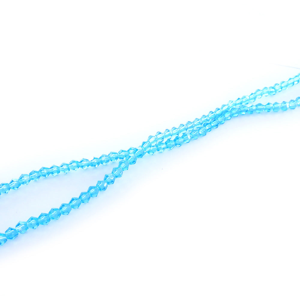 light turquoise glass beads on a white background