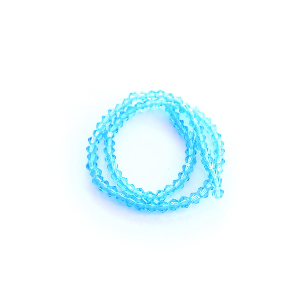 light turquoise glass beads on a white background