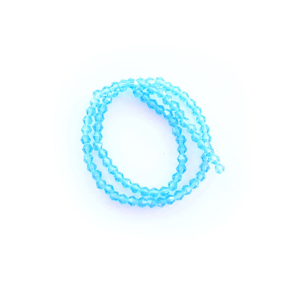 light turquoise glass beads on a white background
