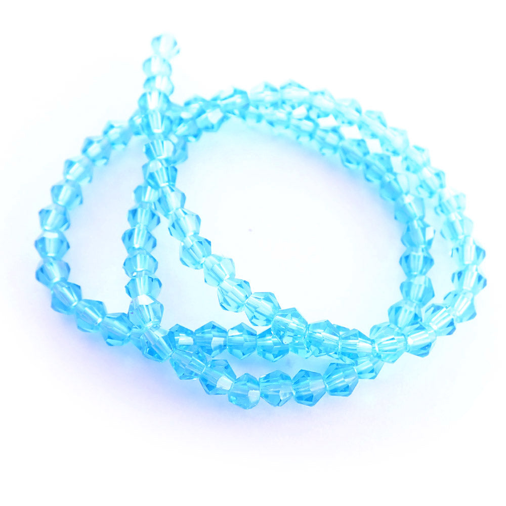 light turquoise glass beads on a white background