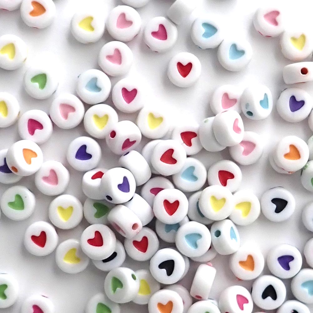white round beads with multi-colored hearts