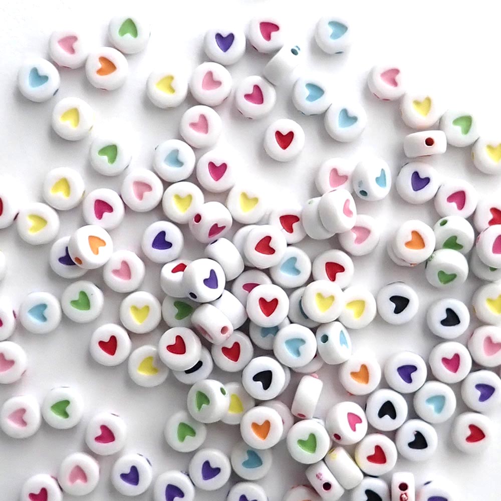 white round beads with multi-colored hearts