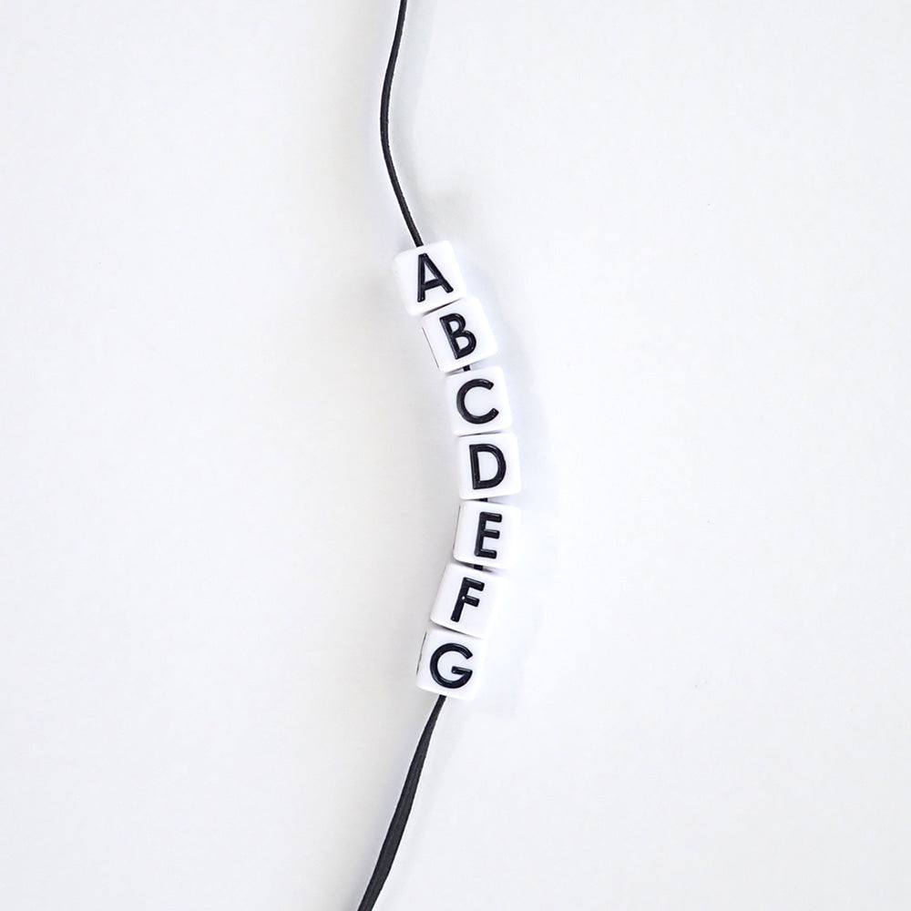 vertical hole alphabet beads strung on elastic