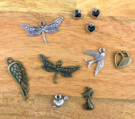 various charms displayed on a wooden table