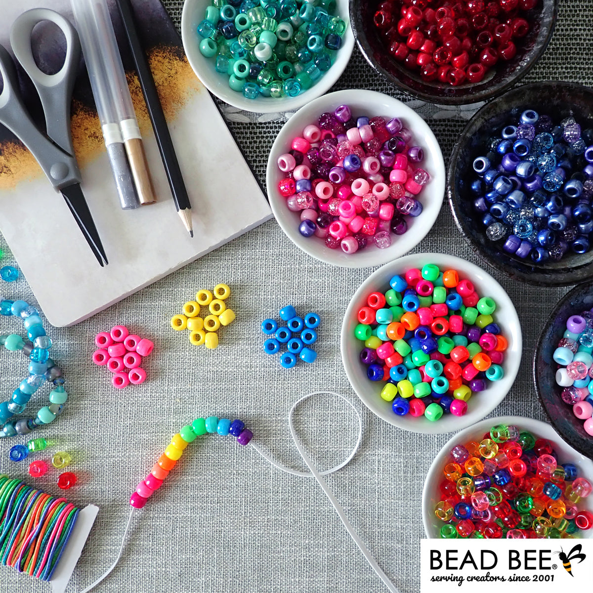 pony beads and crafts on table