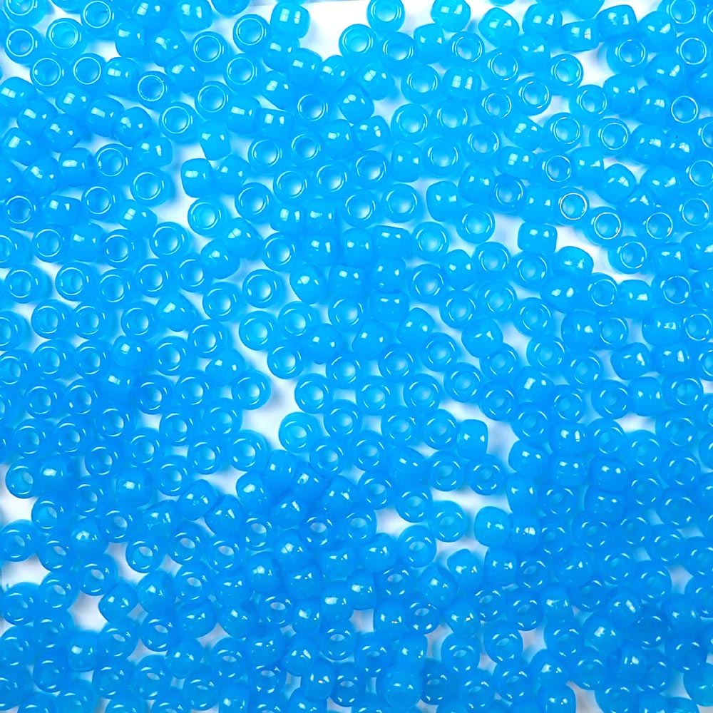 Blue Glow Plastic Pony Beads. Size 6 x 9 mm. Craft Beads. Made in the USA.