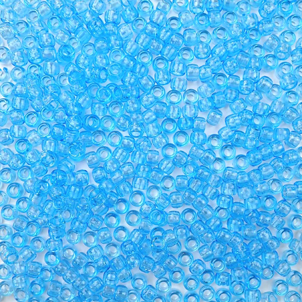6 x 9mm plastic pony beads in transparent light sapphire blue