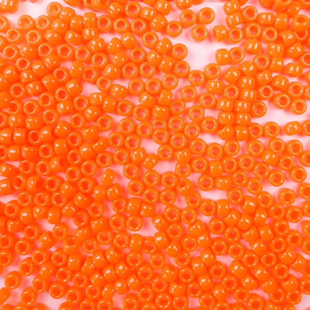 6 x 9mm plastic pony beads in a bright neon orange color